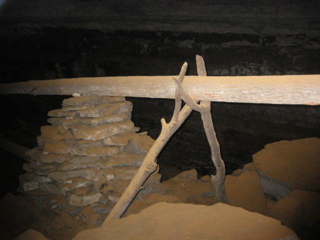 Old wooden pipes in cave